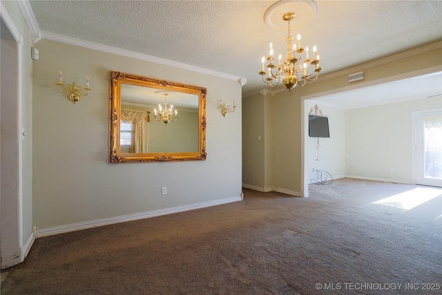 carpeted spare room featuring a textured ceiling, an inviting chandelier, and ornamental molding