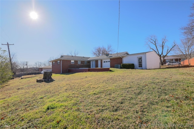 rear view of property with a lawn