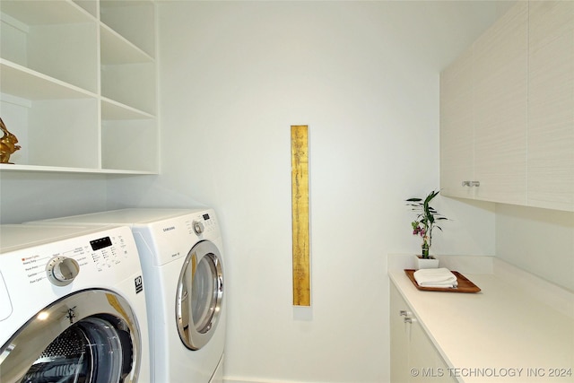 laundry area with washing machine and dryer