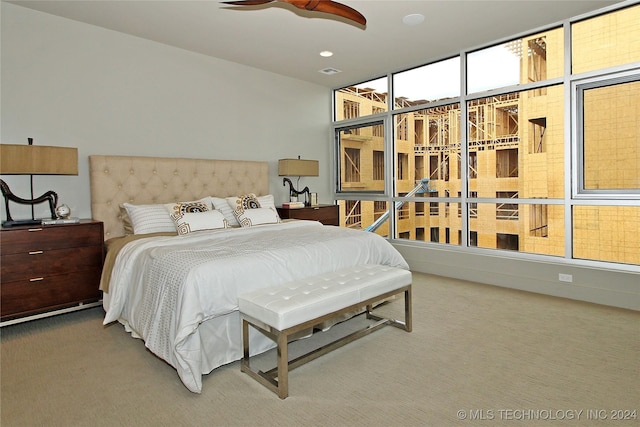 bedroom with ceiling fan and carpet floors