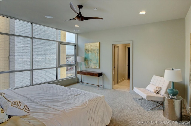 bedroom featuring ceiling fan and light carpet