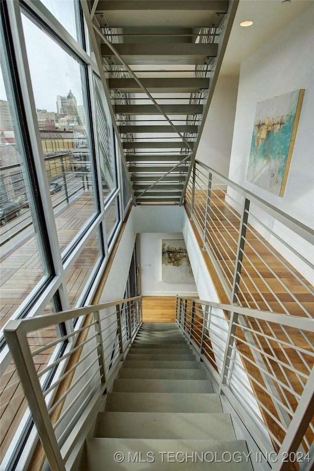 stairs with wood-type flooring