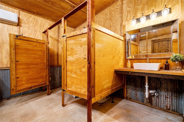 view of horse barn featuring a wall unit AC and sink