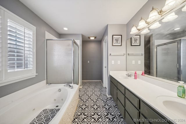 bathroom with tile patterned flooring, vanity, and independent shower and bath