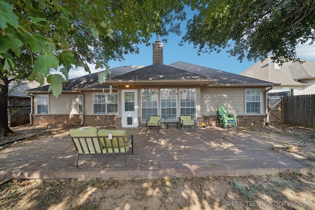 rear view of property featuring outdoor lounge area and a patio