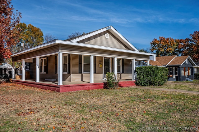 view of front of house featuring a front lawn and a porch