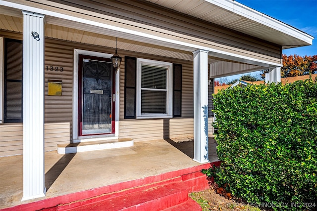 doorway to property featuring a porch