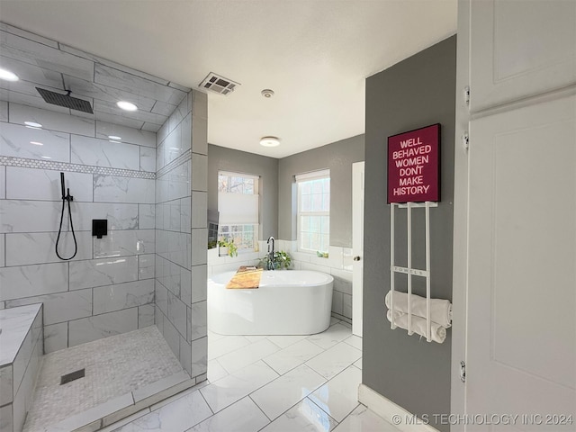 bathroom with independent shower and bath