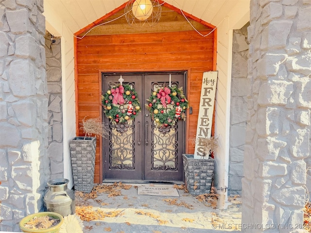 view of exterior entry featuring french doors