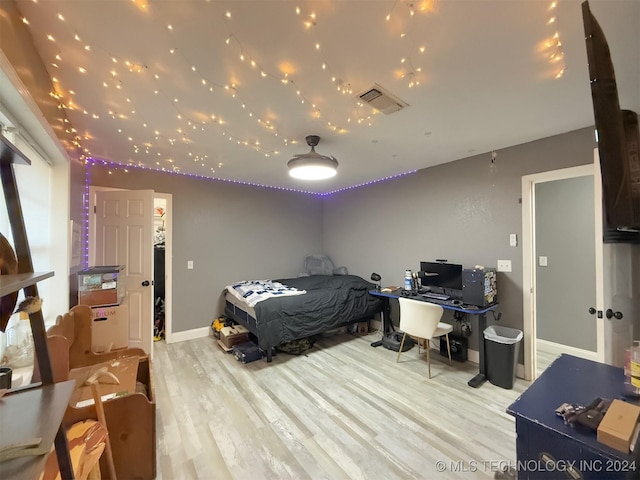 bedroom with light hardwood / wood-style floors