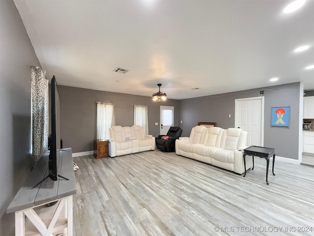 living room with light hardwood / wood-style flooring