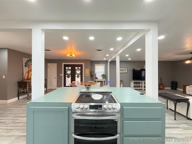 kitchen with french doors, light wood-type flooring, and stainless steel electric range oven