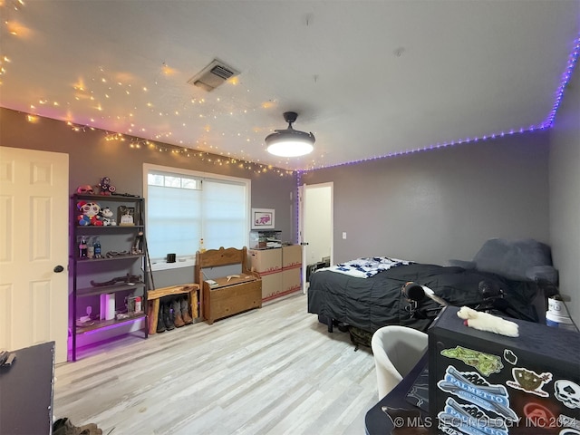 bedroom with light hardwood / wood-style flooring