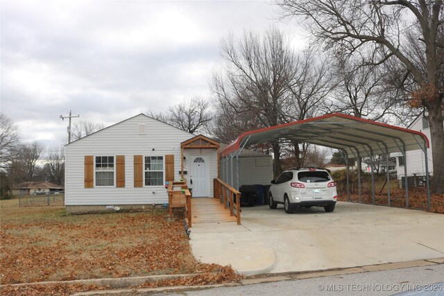 view of front of property featuring a carport