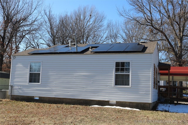 view of home's exterior with solar panels