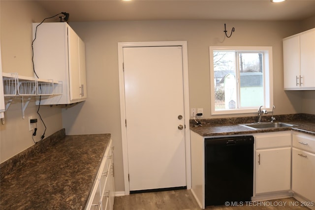 kitchen featuring white cabinets, light hardwood / wood-style flooring, sink, and dishwasher