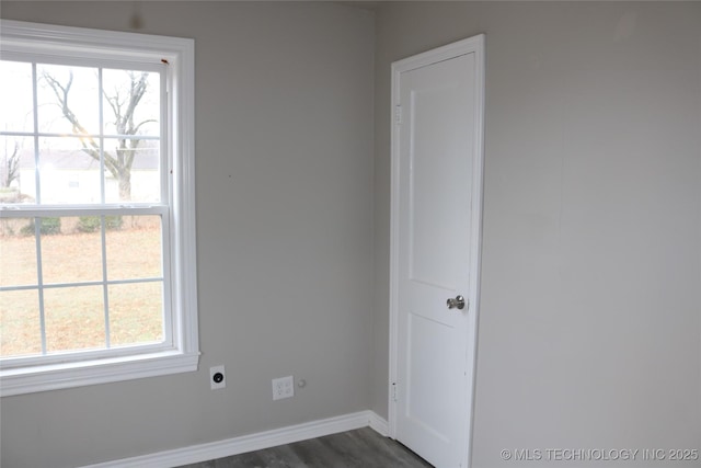 unfurnished room featuring dark hardwood / wood-style flooring