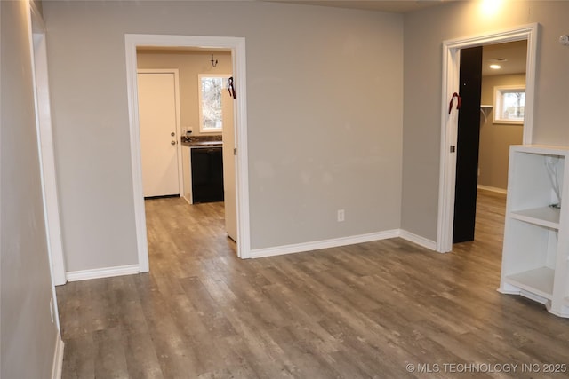 unfurnished room with hardwood / wood-style flooring