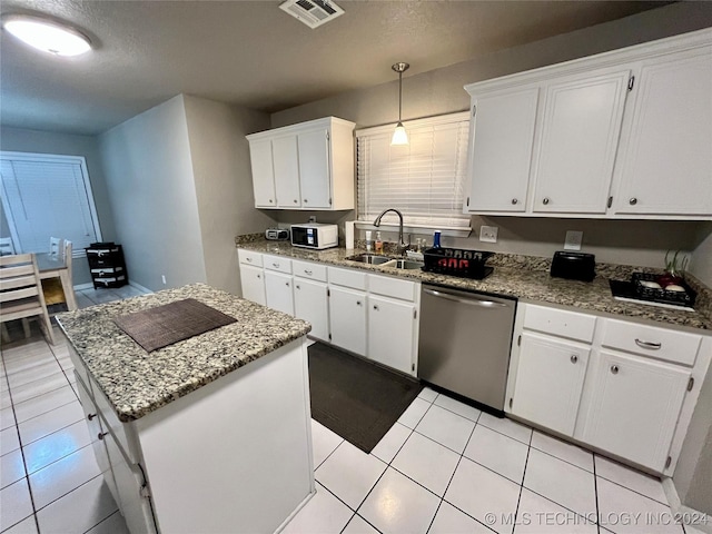 kitchen with white cabinets, sink, decorative light fixtures, dishwasher, and a center island