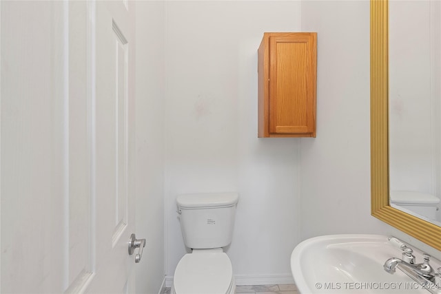 bathroom with toilet and sink