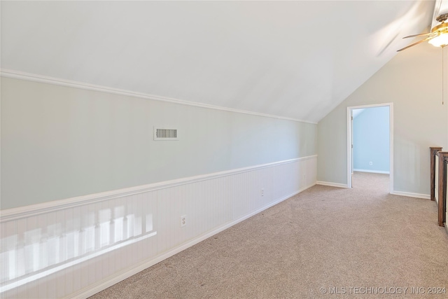 bonus room featuring ceiling fan, light carpet, and vaulted ceiling