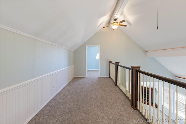 additional living space with light colored carpet, vaulted ceiling, and ceiling fan