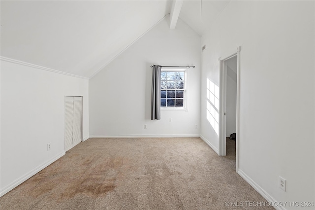 bonus room with carpet, beam ceiling, and high vaulted ceiling