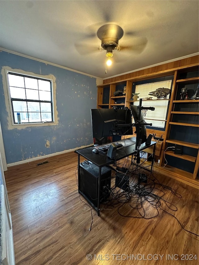 home office featuring hardwood / wood-style flooring, ceiling fan, and ornamental molding