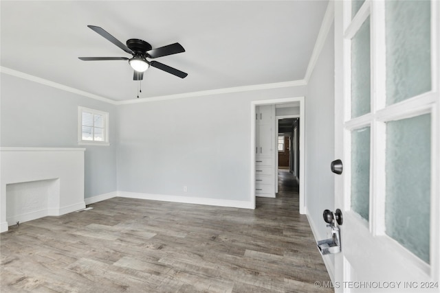 unfurnished living room with hardwood / wood-style floors, ceiling fan, and crown molding