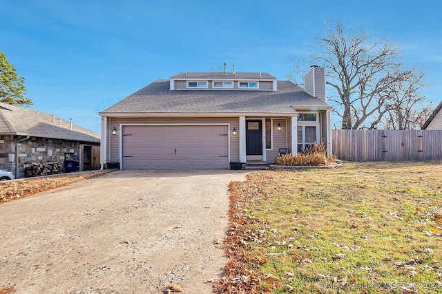 view of front facade with a garage and a front lawn