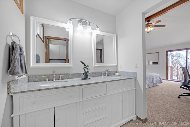 bathroom with ceiling fan and vanity