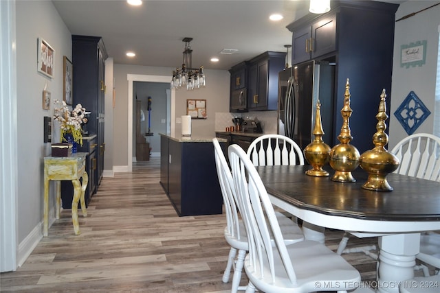 dining area with light hardwood / wood-style floors