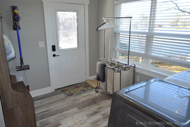 foyer with light hardwood / wood-style floors and washer / clothes dryer