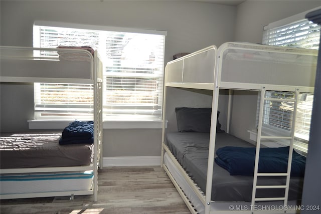 bedroom featuring wood-type flooring