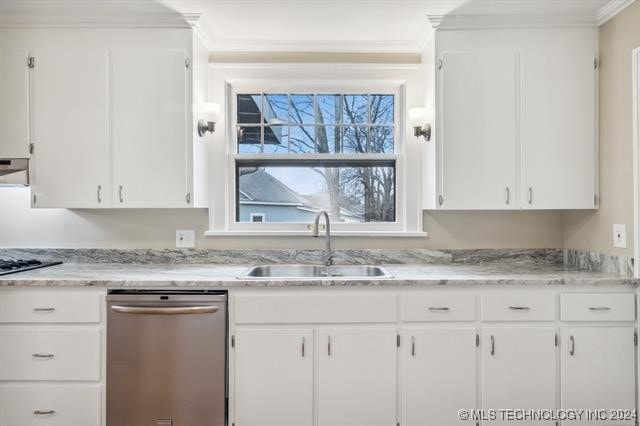 kitchen with dishwasher, white cabinets, and sink