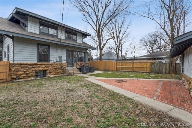 view of yard with central AC