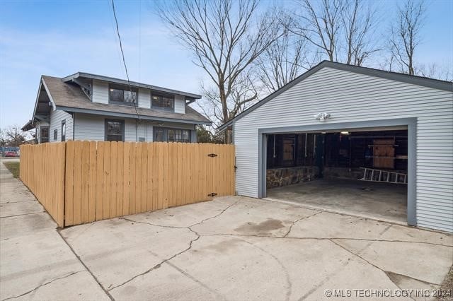 exterior space featuring an outdoor structure and a garage