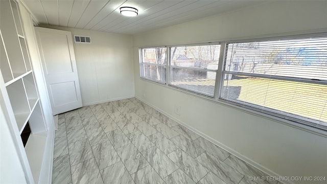 spare room with wood ceiling