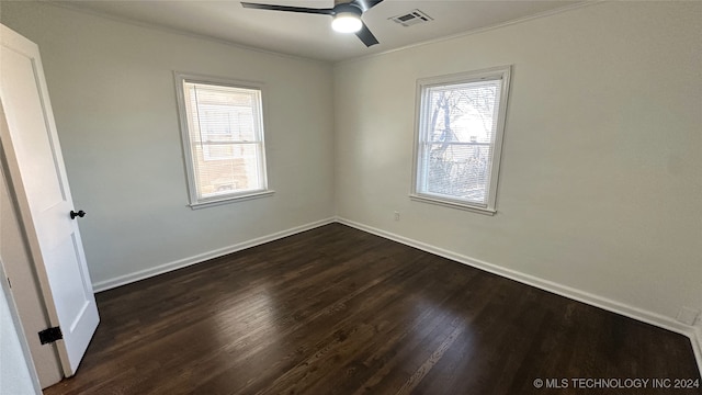 unfurnished room with ceiling fan, dark hardwood / wood-style flooring, and crown molding