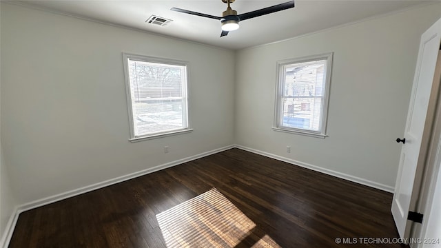 unfurnished room with dark hardwood / wood-style floors, ceiling fan, and ornamental molding