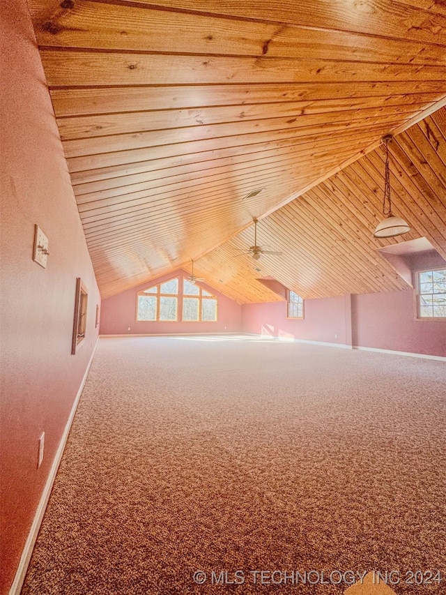 additional living space featuring carpet floors, vaulted ceiling, ceiling fan, and wooden ceiling