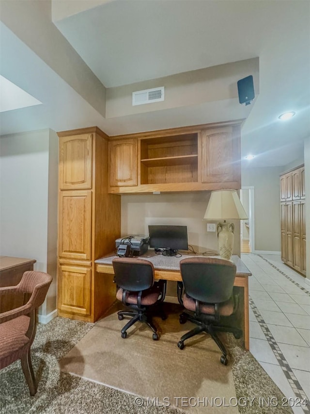 tiled home office featuring built in desk