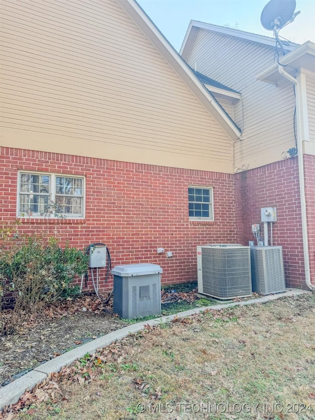 view of side of home featuring cooling unit