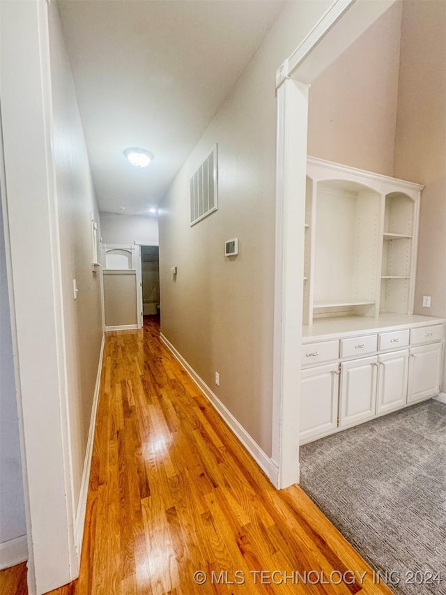 hallway with light wood-type flooring