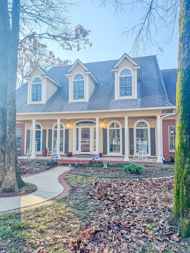 cape cod home with covered porch