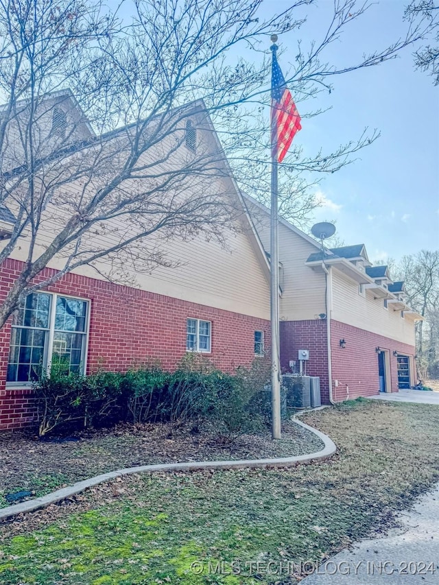 view of side of property featuring a garage