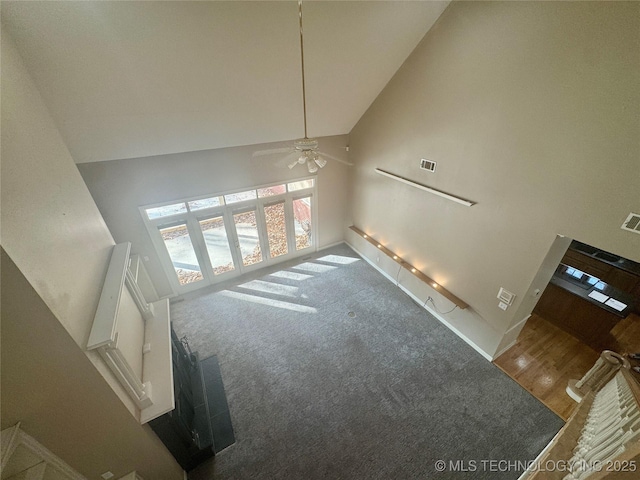 living room with high vaulted ceiling and ceiling fan