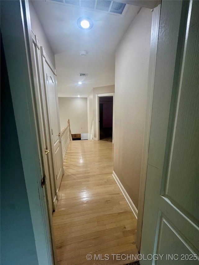 hallway featuring light wood-type flooring