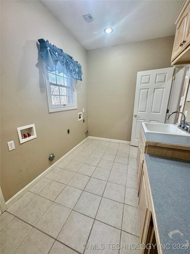 washroom featuring washer hookup, hookup for an electric dryer, cabinets, and sink