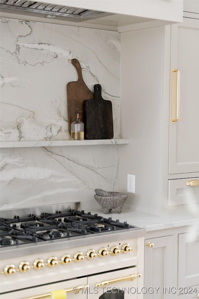 kitchen featuring white cabinets and gas stovetop